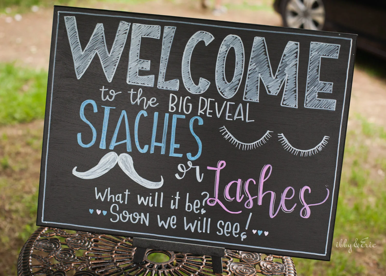 Staches or lashes chalkboard sign design for gender reveal party in western Massachusetts.
