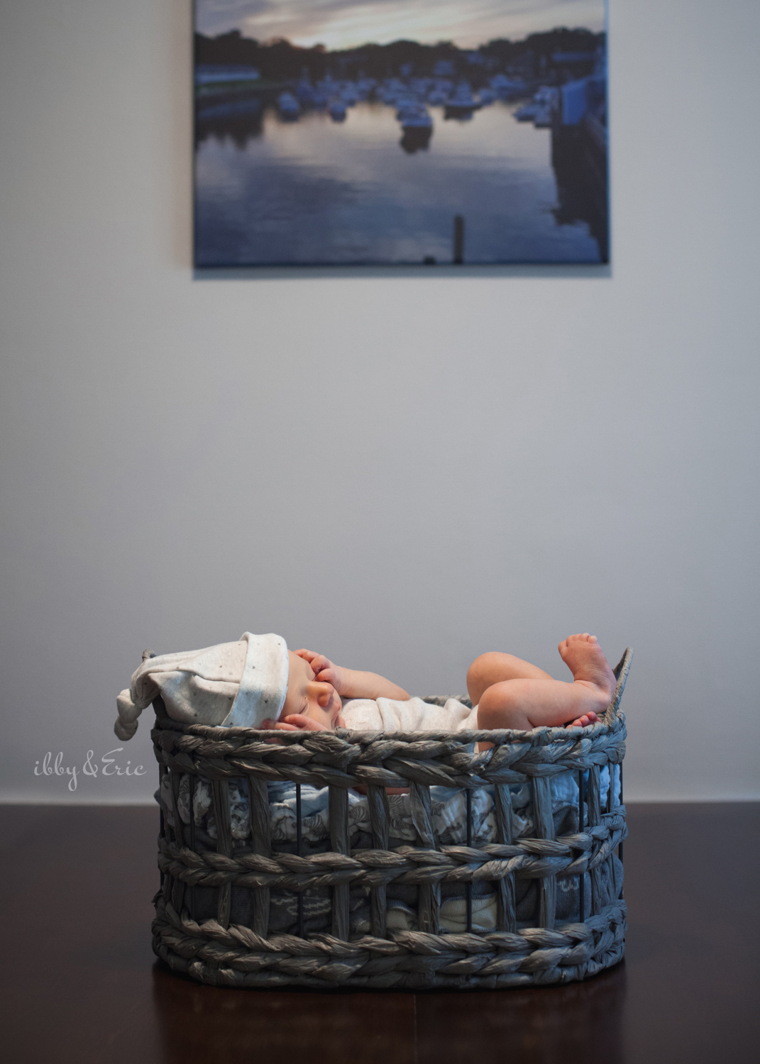 Massachusetts in home newborn photo of a one week old baby boy in a gray basket.