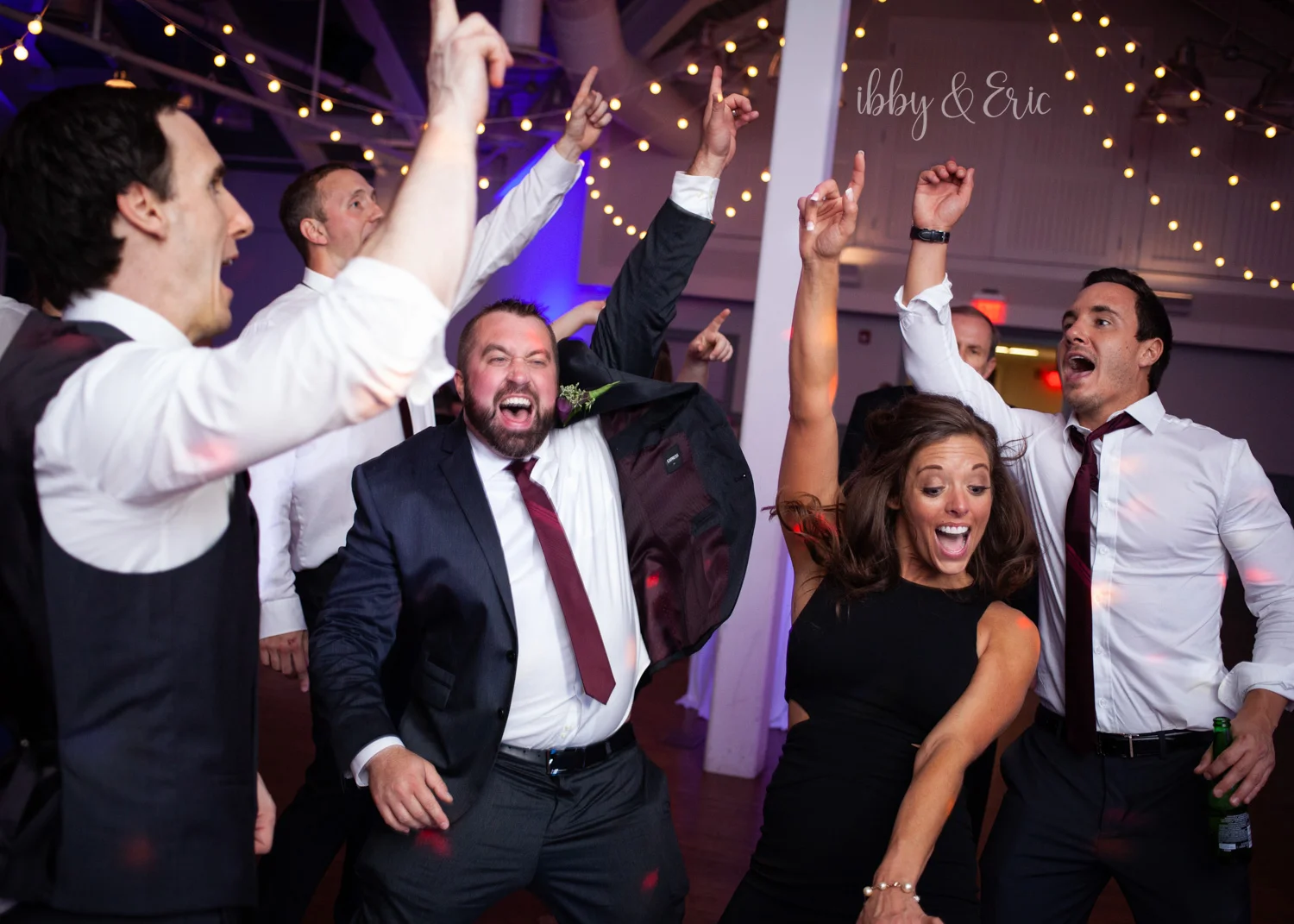 Groom and friends dance during the Glastonbury Boathouse wedding reception.