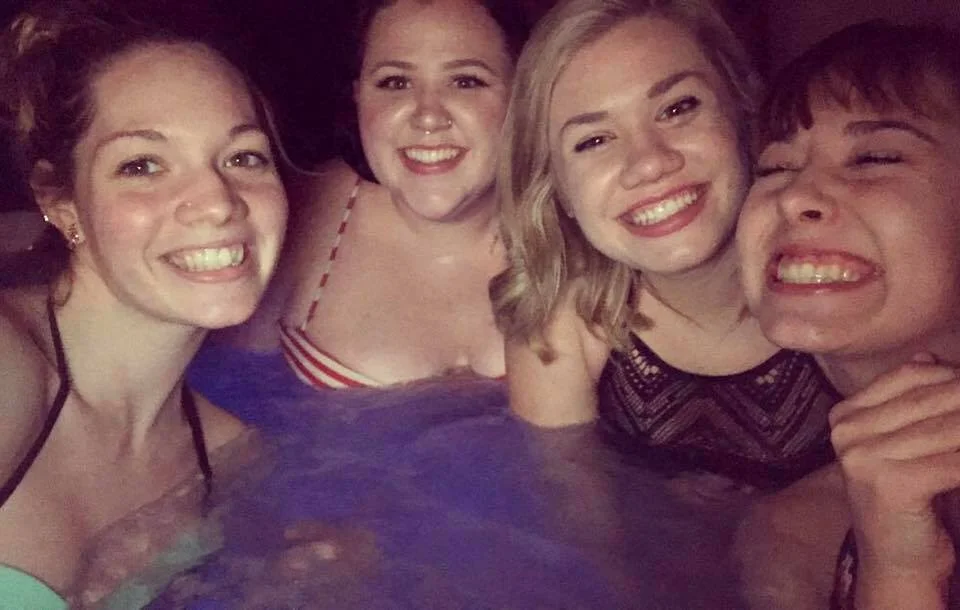 Me, (middle on the left) with my friends, in a full face of makeup while in a hot tub. A hot tub.
