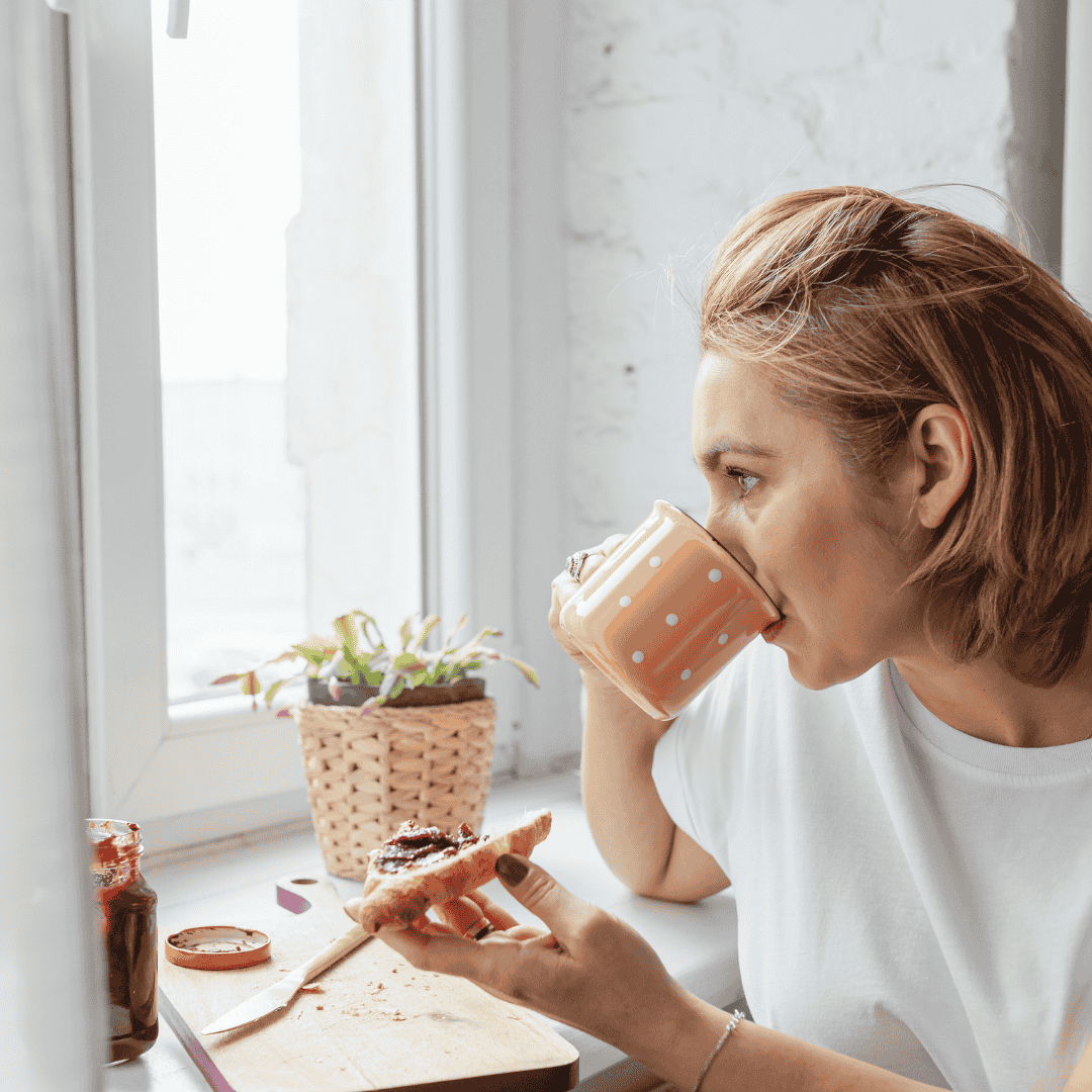 A person enjoying a calm, balanced meal with toast and fruit, symbolizing nourishment, body trust, and freedom from restrictive dieting.