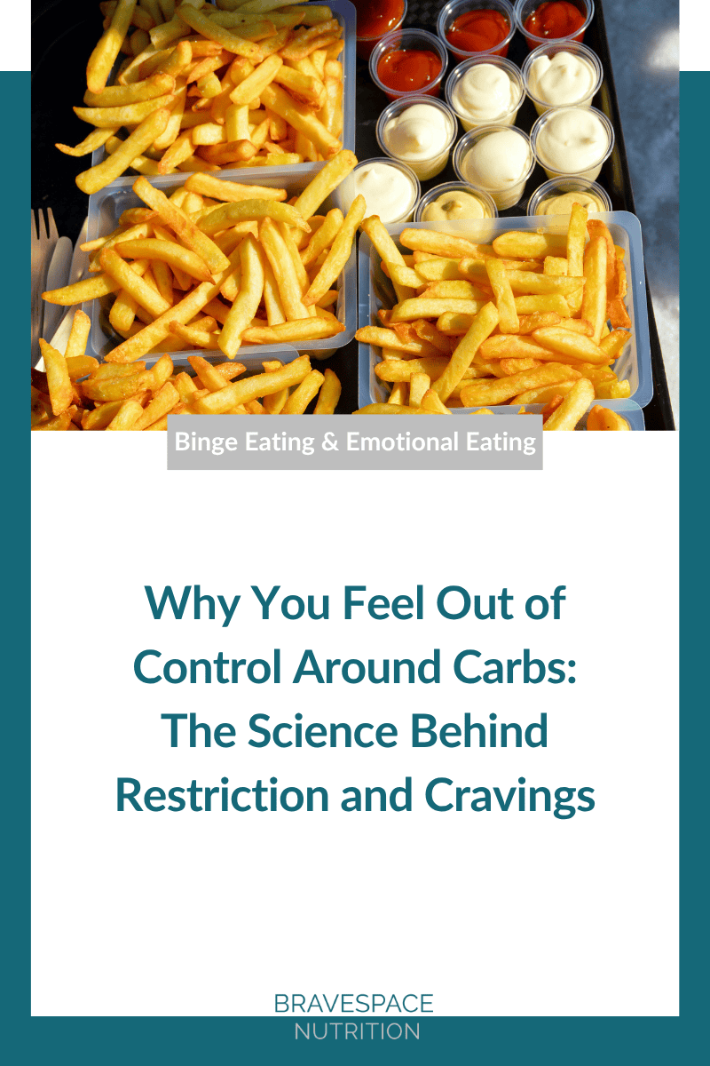 Tray of French fries with ketchup and mayo showing carb cravings from Bravespace Nutrition article.