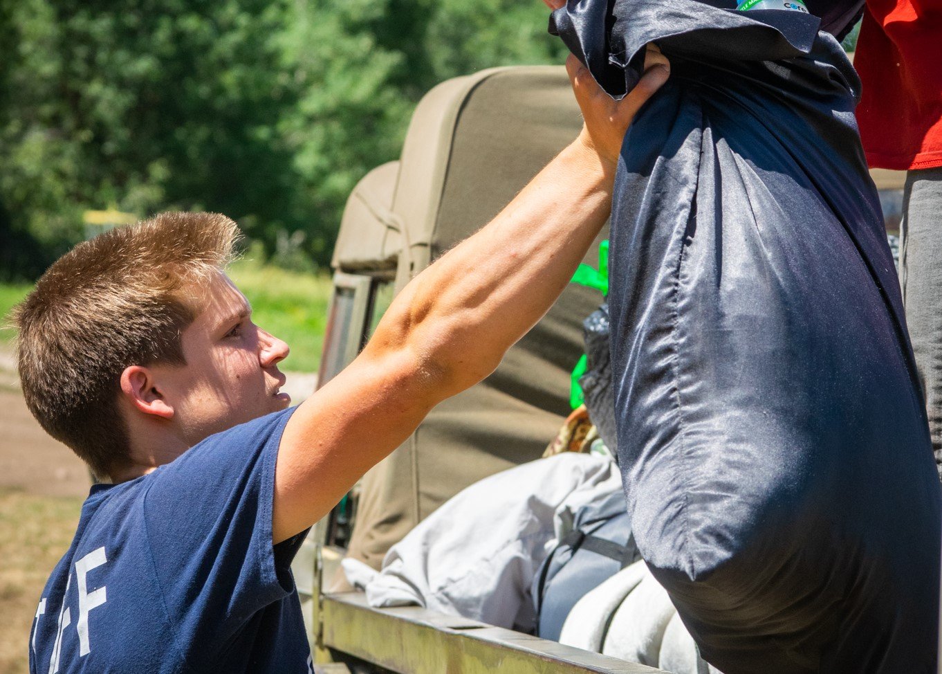 Once done with check-in, our staff will load your camper's luggage on a vehicle.