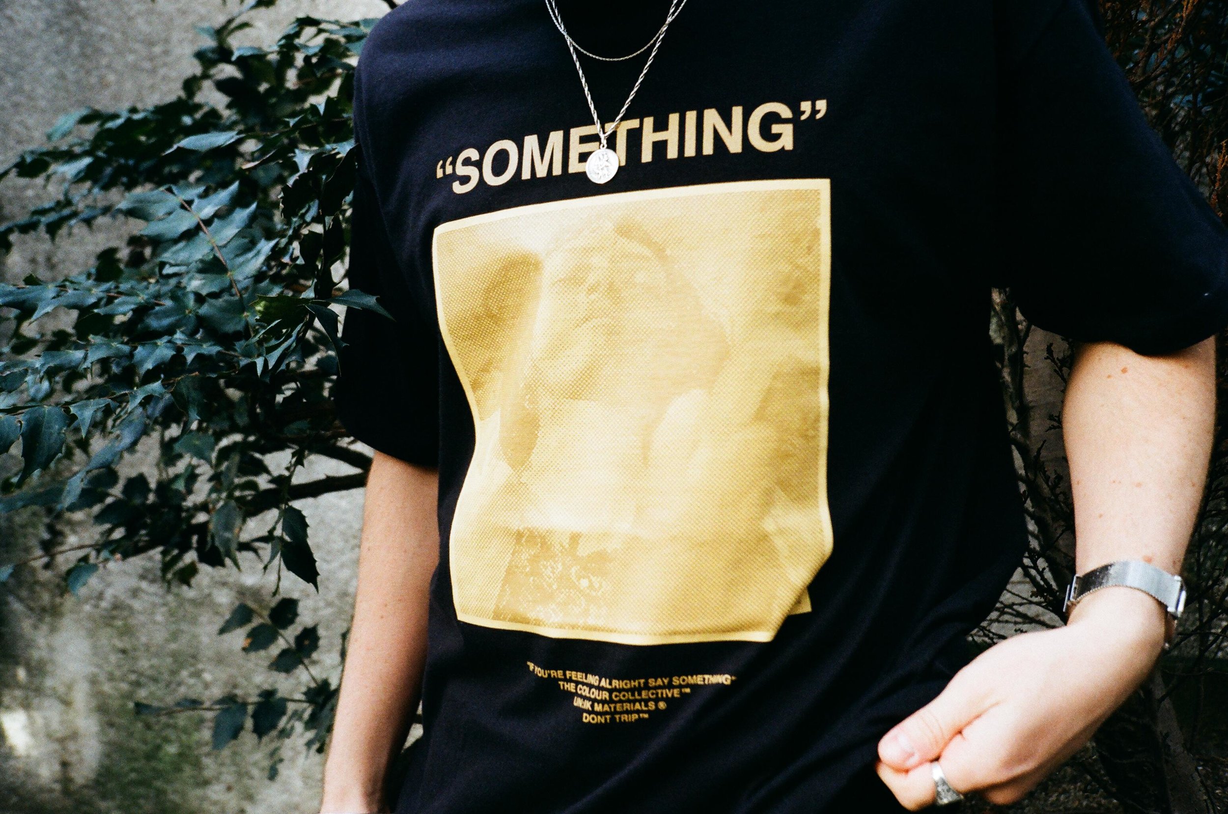 COLOUR COLLECTIVE ‘SOMETHING’ TEE -  first introduced in mustard, the best seller for CC - period. The ‘Pulp Fiction’ concept that fitted the originality of the brand so well. Flipped in this special black colourway for the 5 year special.