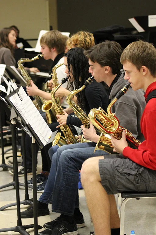 Senior high school saxophone students in rehearsal at a district jazz festival.