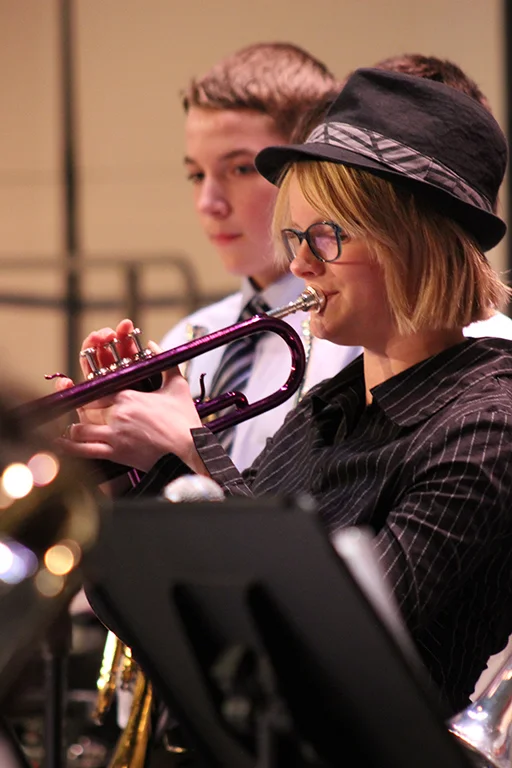 Student trumpet player performing at a district festival