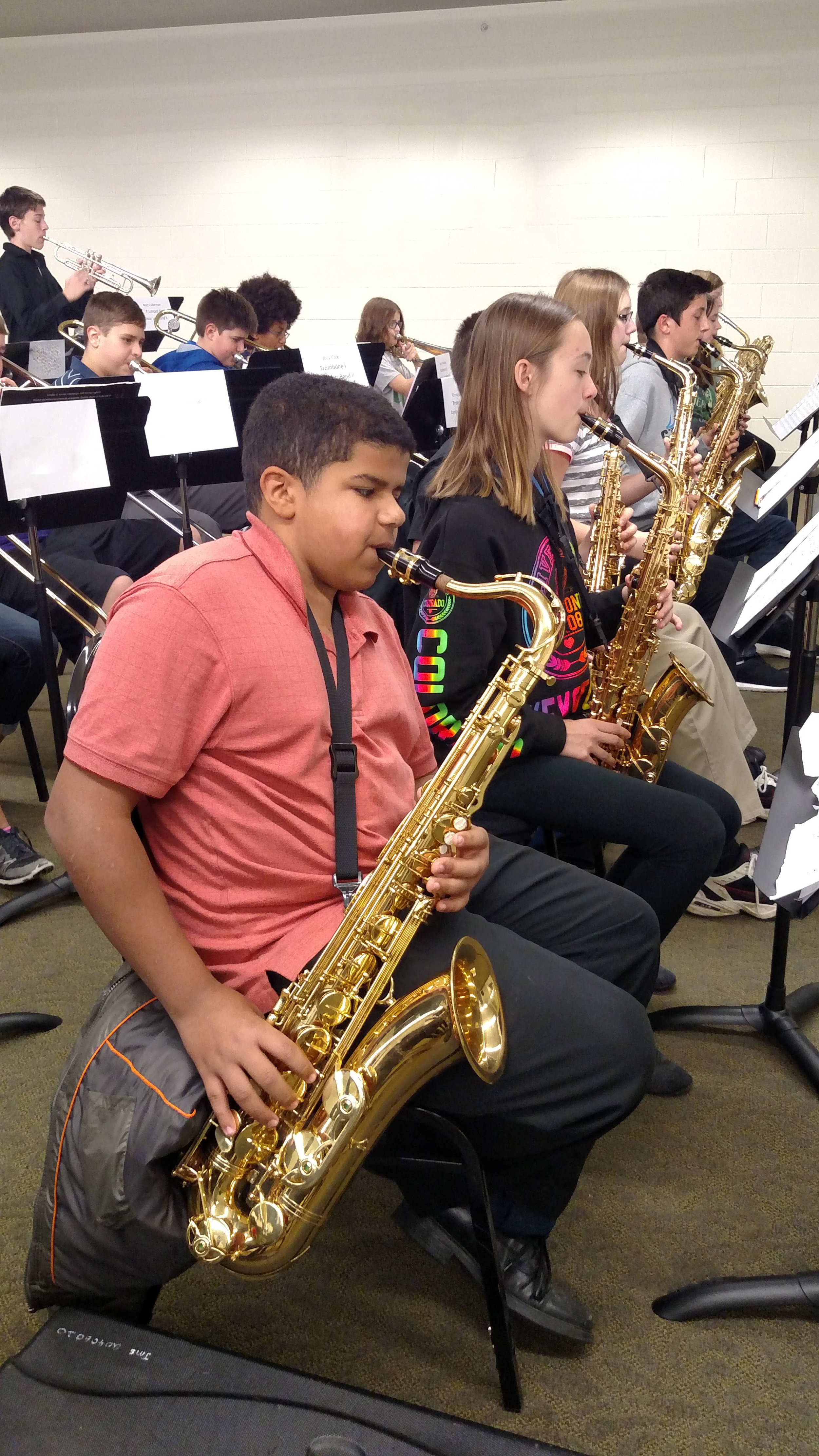 Student saxophone player in rehearsal at a district festival
