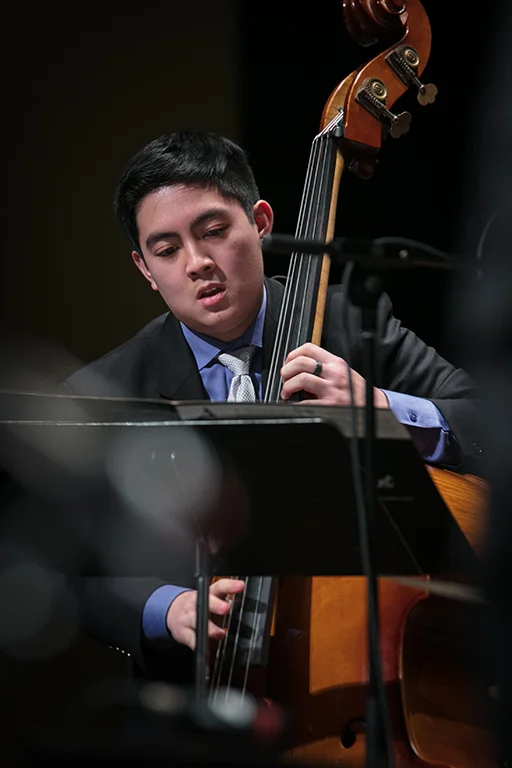 Bassist performing with a jazz ensemble at All-State Jazz Night