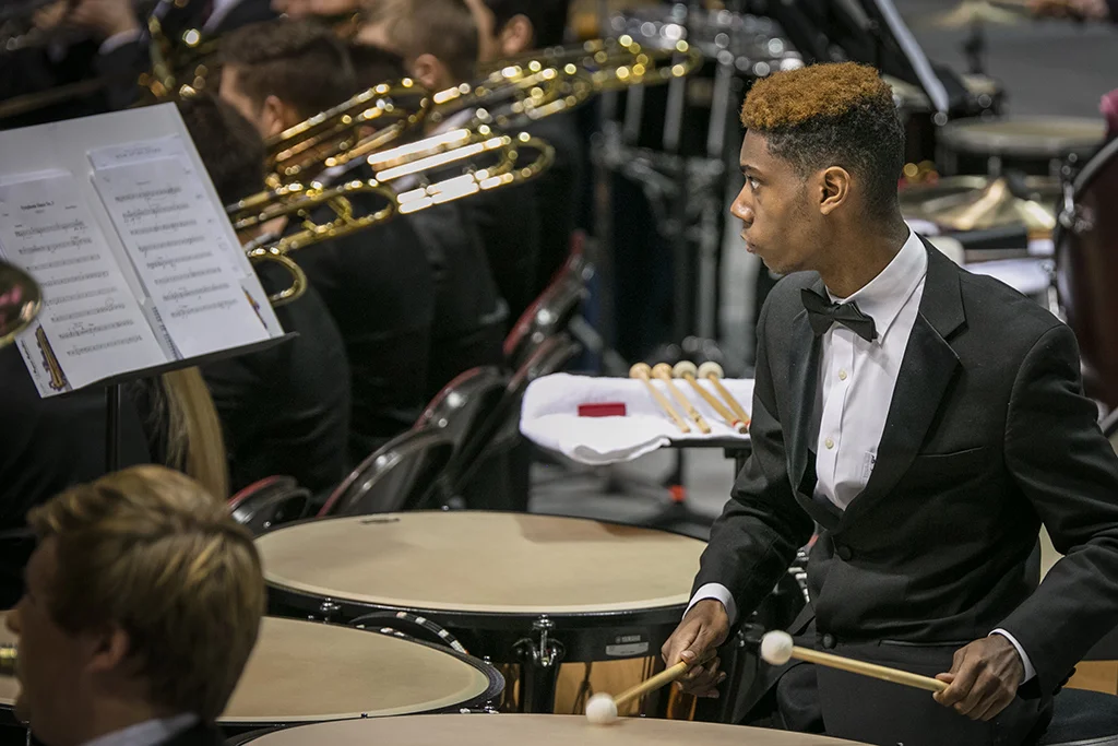 Student playing timpani at All-State concert