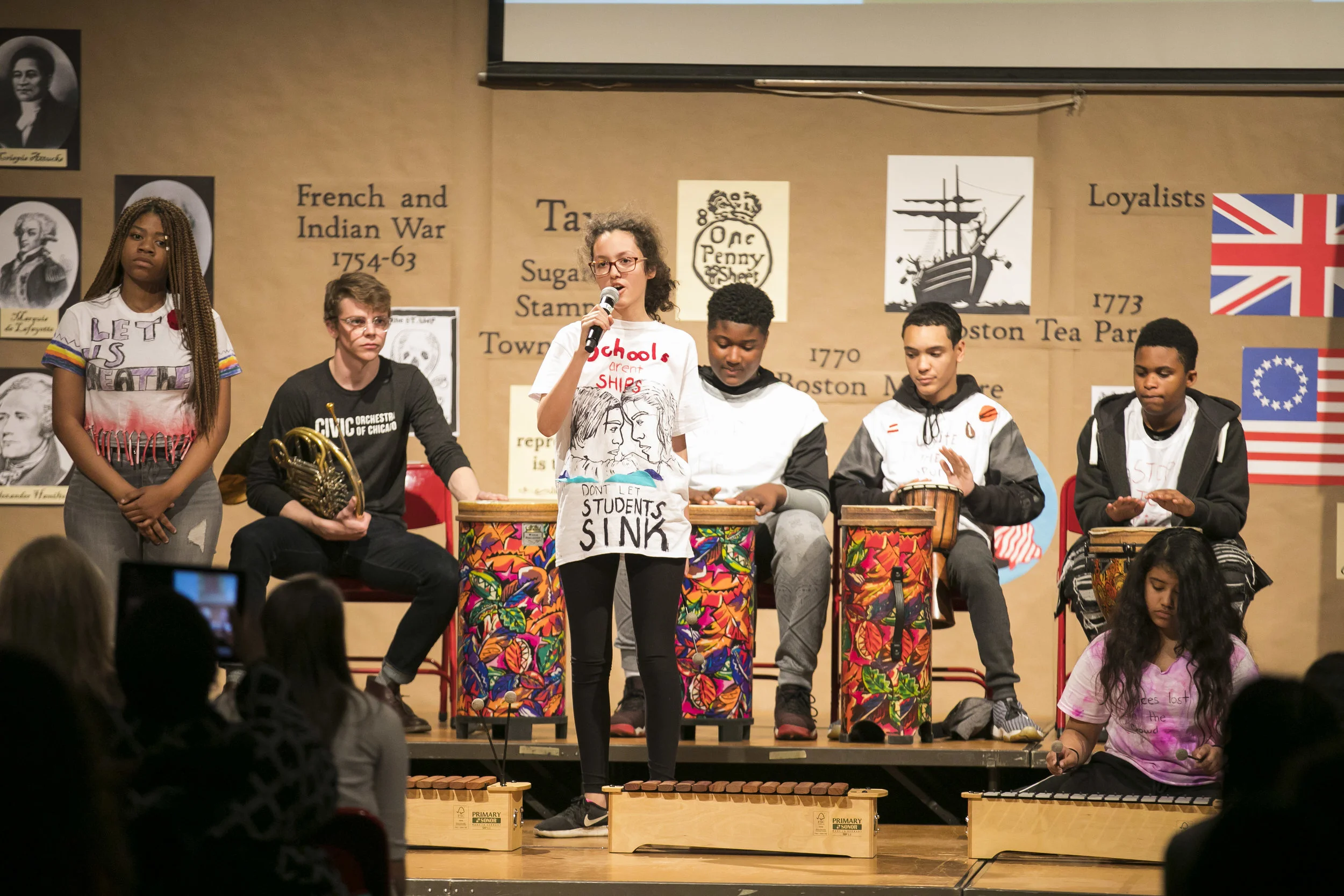 Students from Agassiz Elementary and Civic Fellow Corin Droullard perform a protest song written as part of the CSO-Connect school partnership program. | © Todd Rosenberg Photography