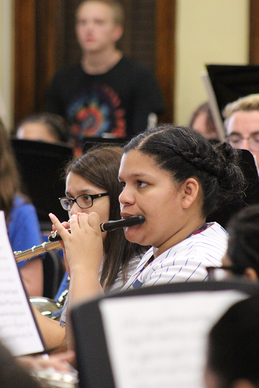 Female student rehearsing on the piccolo