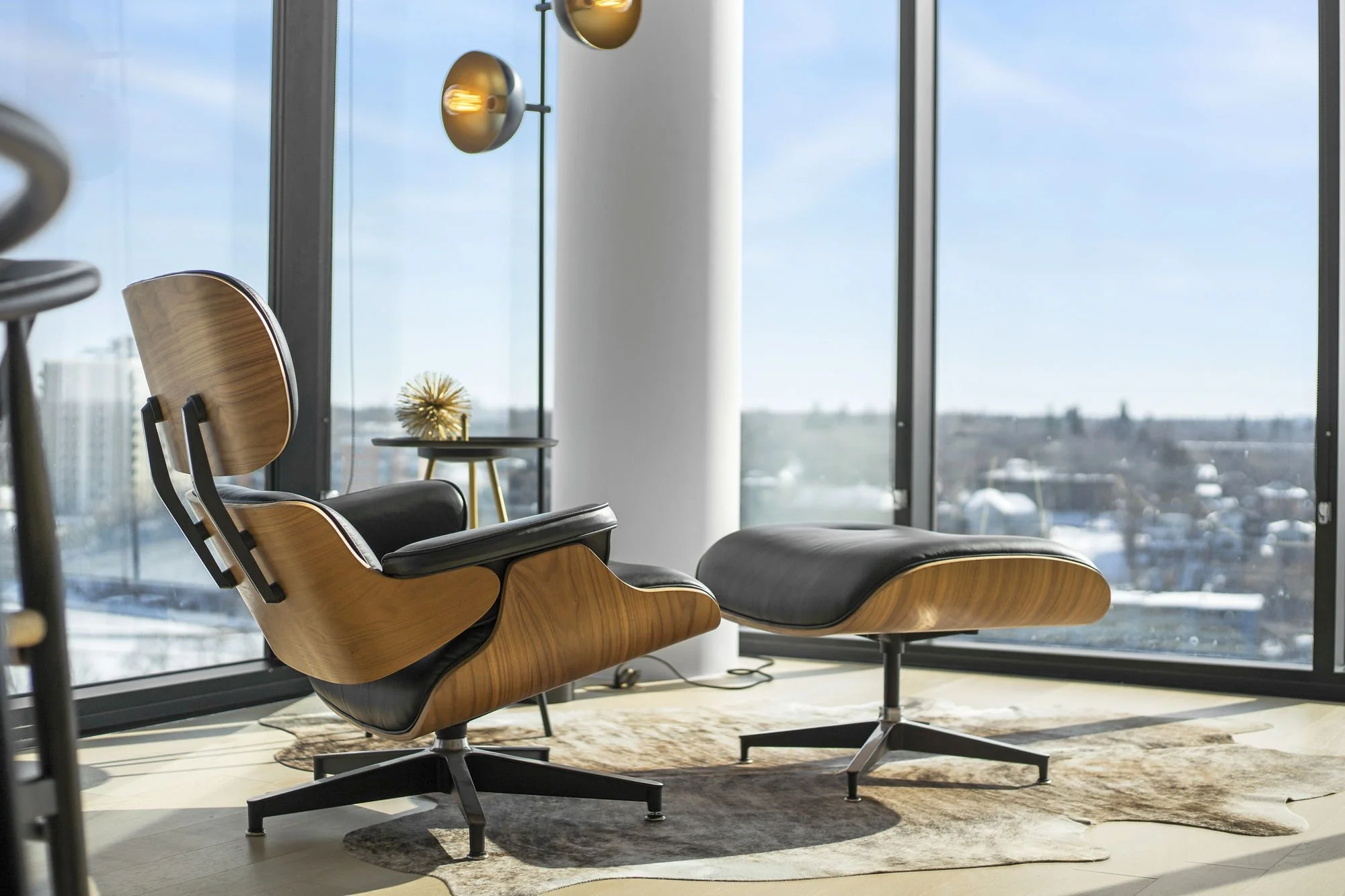 Metric offers Interior Decorating, and interior styling. Metric's team of stylists select furniture and decor that perfectly aligns with clients' tastes. This downtown Saskatoon Riverfront condo has panoramic views of the south Saskatchewan river