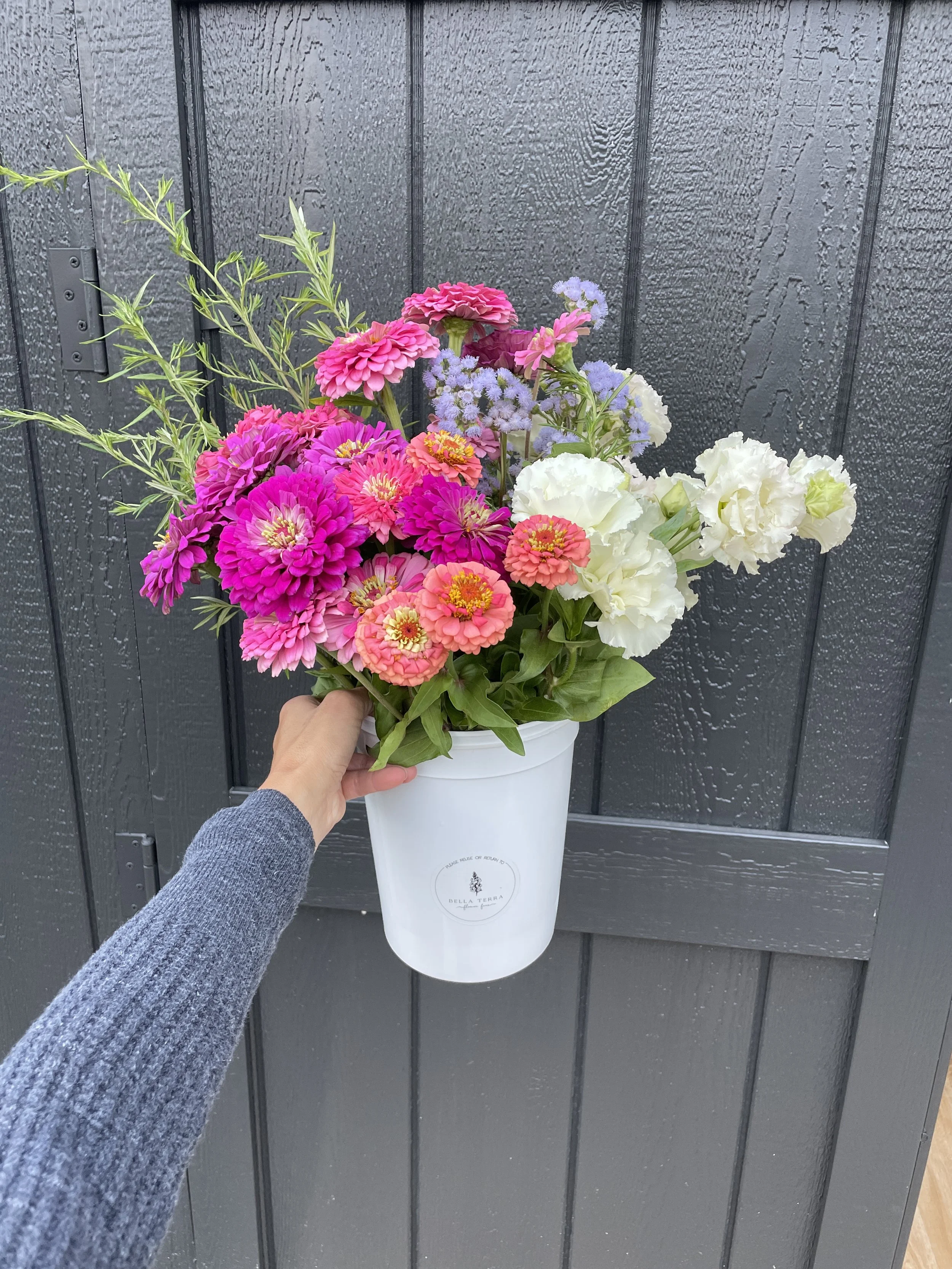 you pick bucket with flowers.JPG