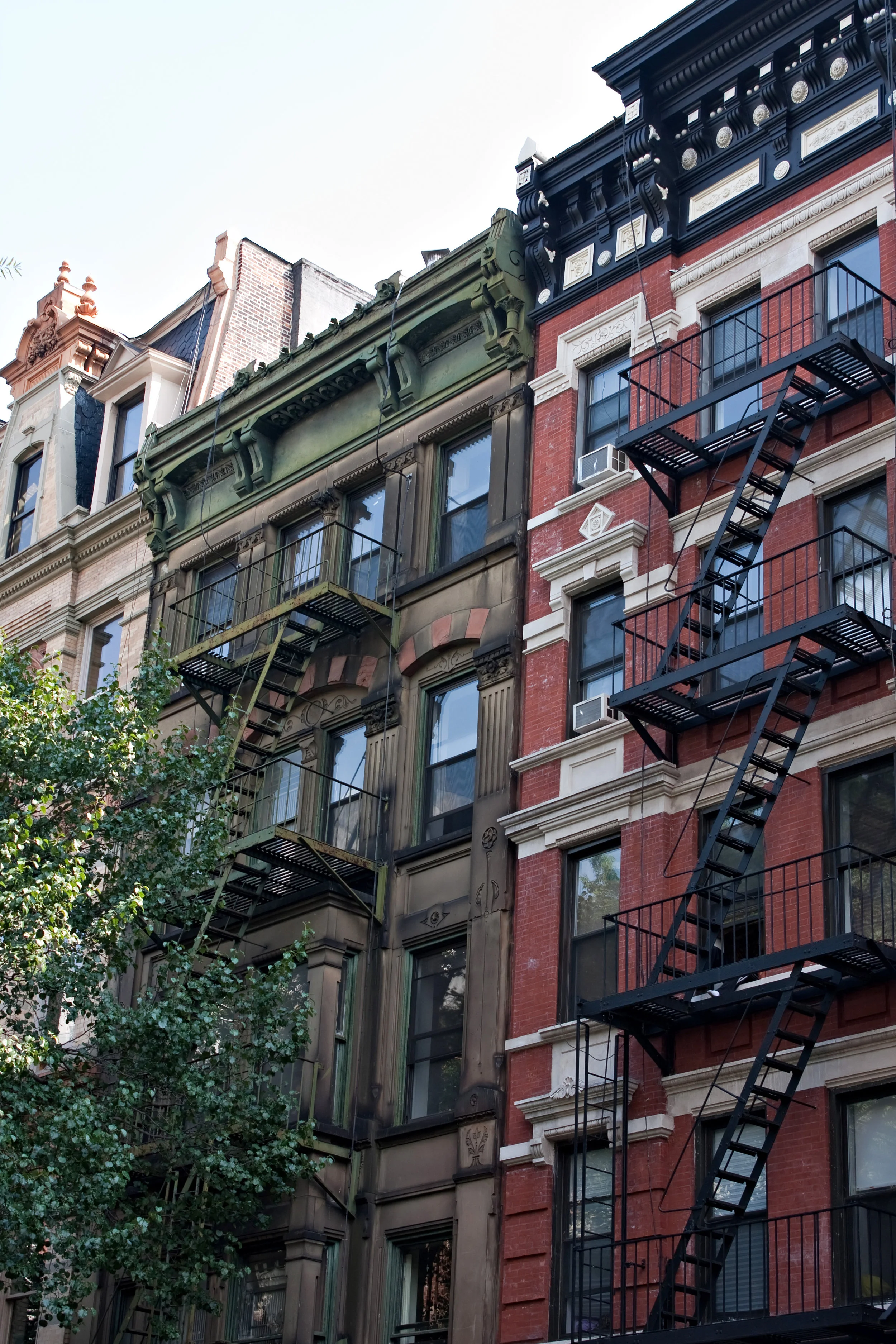 some-vintage-tenement-buildings-with-iron-fire-escapes_BtUeKLASo.jpg