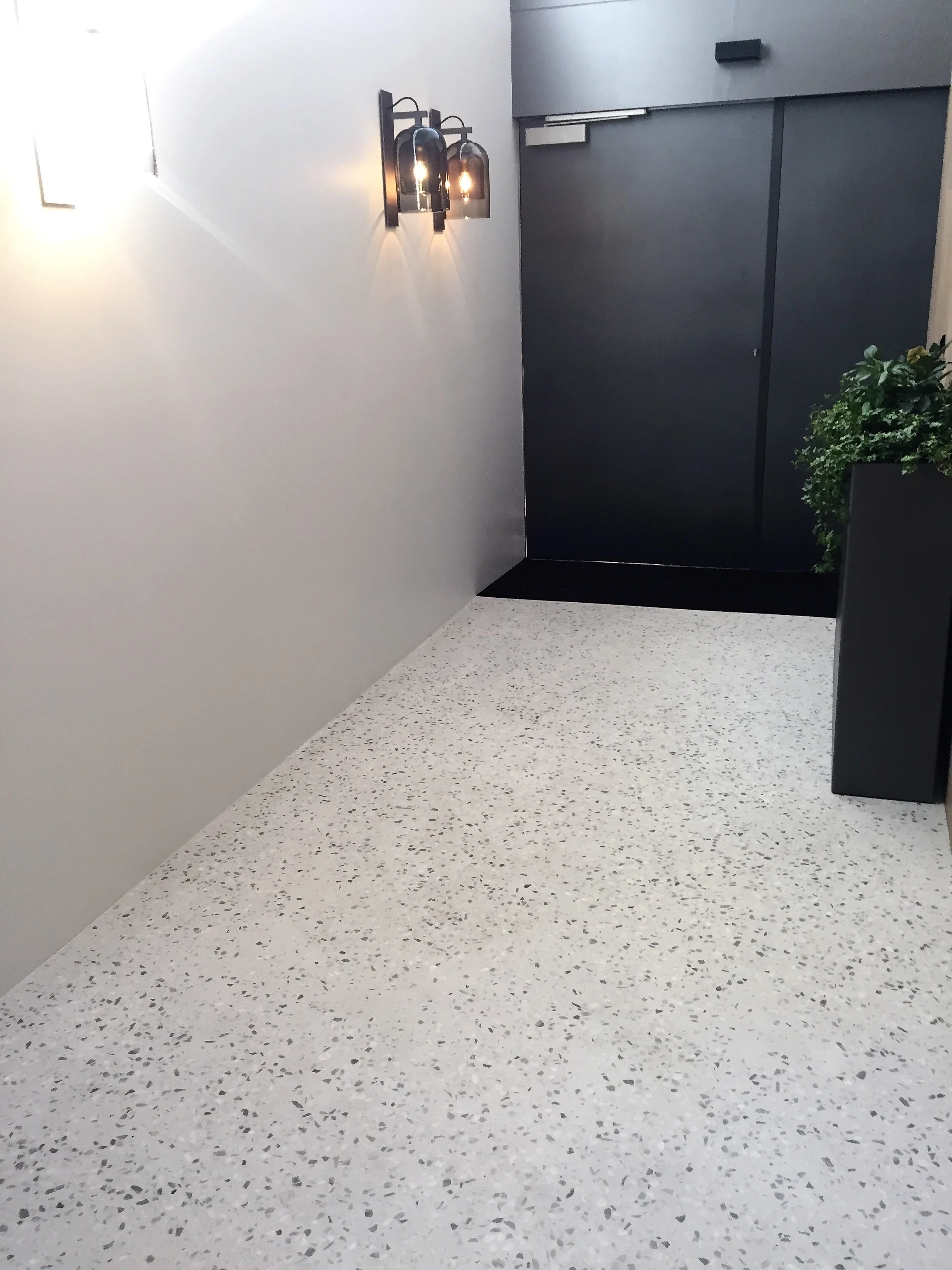 Traditional concrete terrazzo in an incredibly thin real concrete overlay Covet