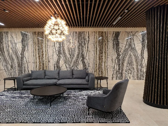 Lakeside Apartments Lobby - Melbourne VIC Ever Art Wood® Kabebari-T Suspended Ceiling System - Kabebari 30x85 battens in Kuri Masame; Custom powdercoated T section in Black