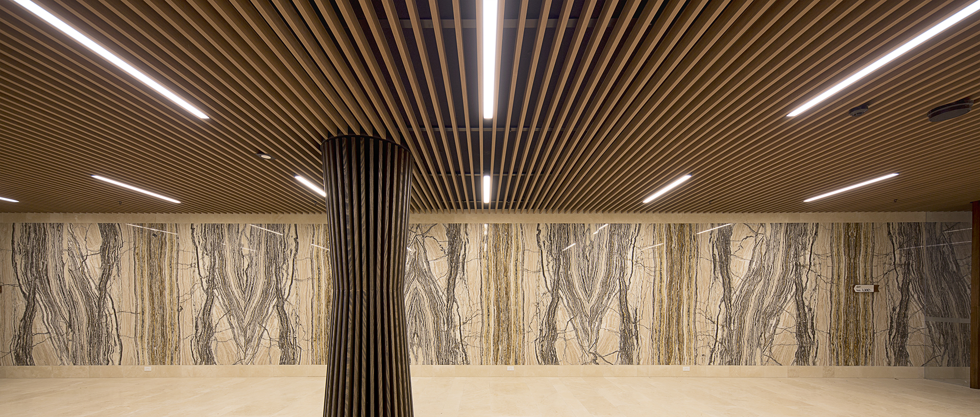  Lakeside Apartments Lobby - Melbourne VIC Ever Art Wood® Kabebari-T Suspended Ceiling System - Kabebari 30x85 battens in Kuri Masame; Custom powdercoated T section in Black 