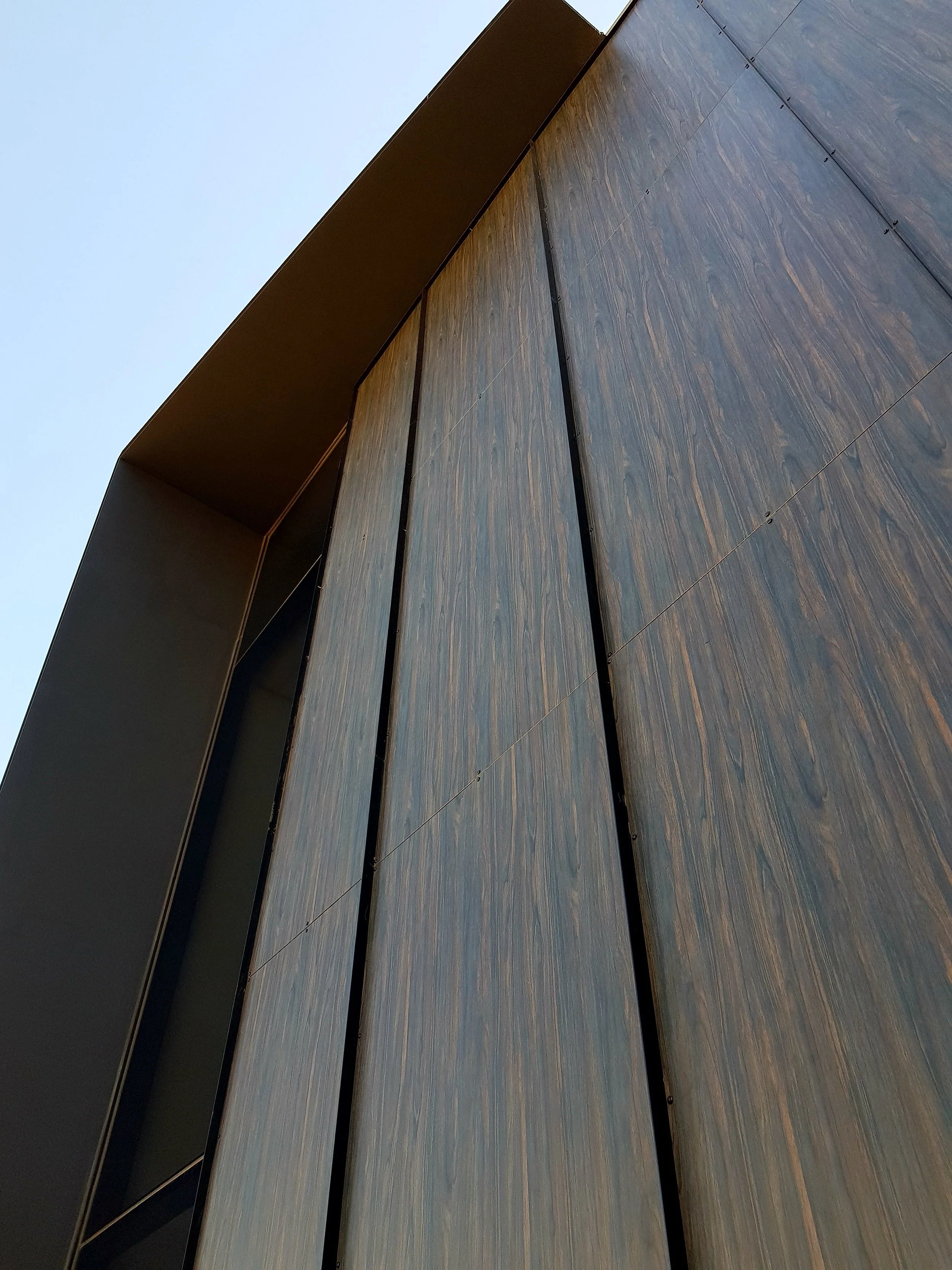 Wood look flat sheet cladding panels