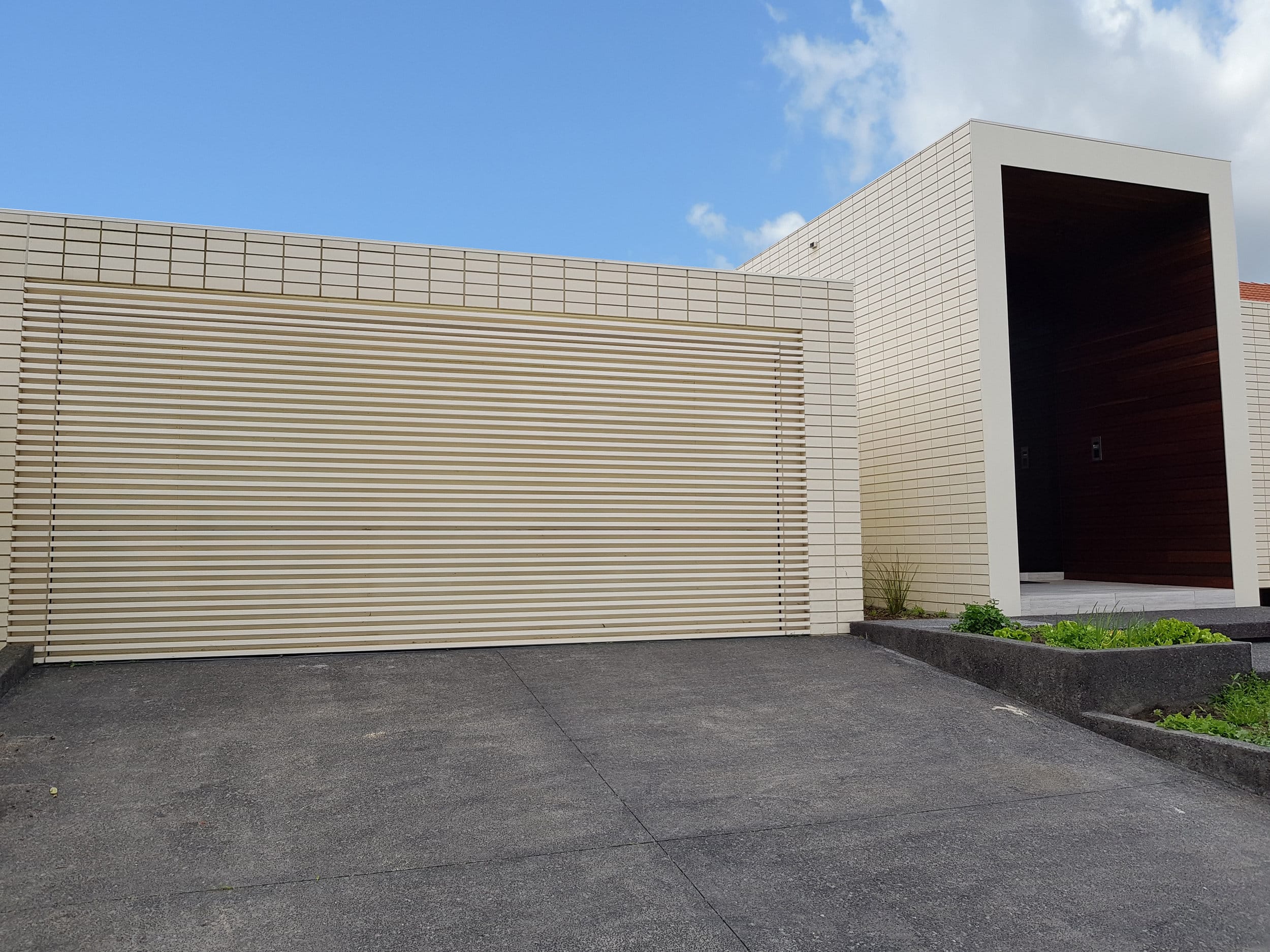  Private Residence - Ivanhoe VIC Ever Art Wood® battens - Kabebari 30x50 to garage doors in custom powdercoat 