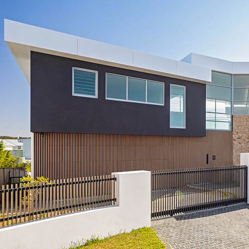 A timber look batten facade with concealed doorways in NSW