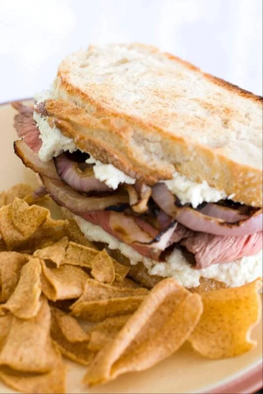 Guinness Marinated Flank Steak Sandwich with Grilled Onions and Boursin