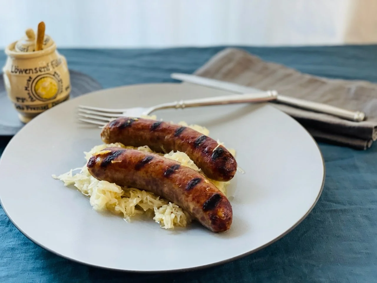 Brats with German Riesling, Sauerkraut and Caraway Seeds