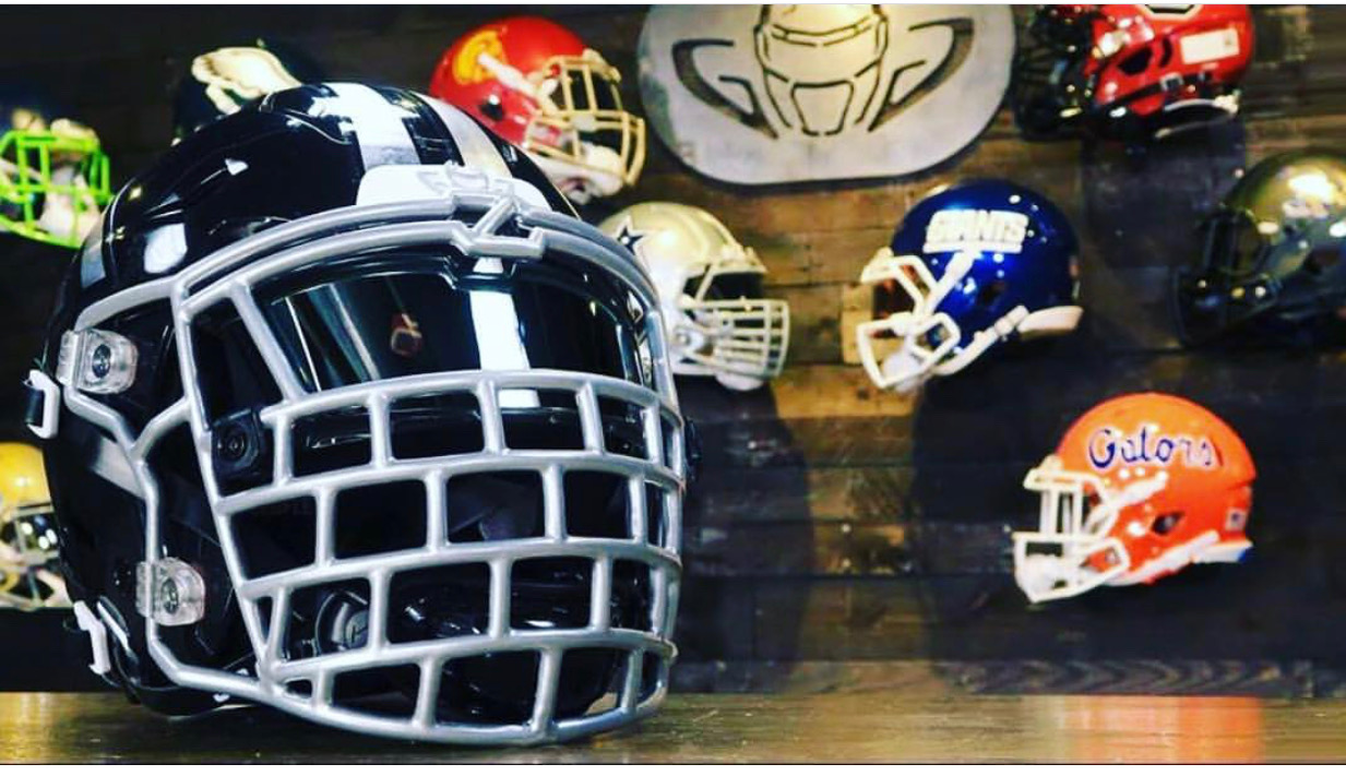 Zuti Facemasks on Set with Green Gridiron