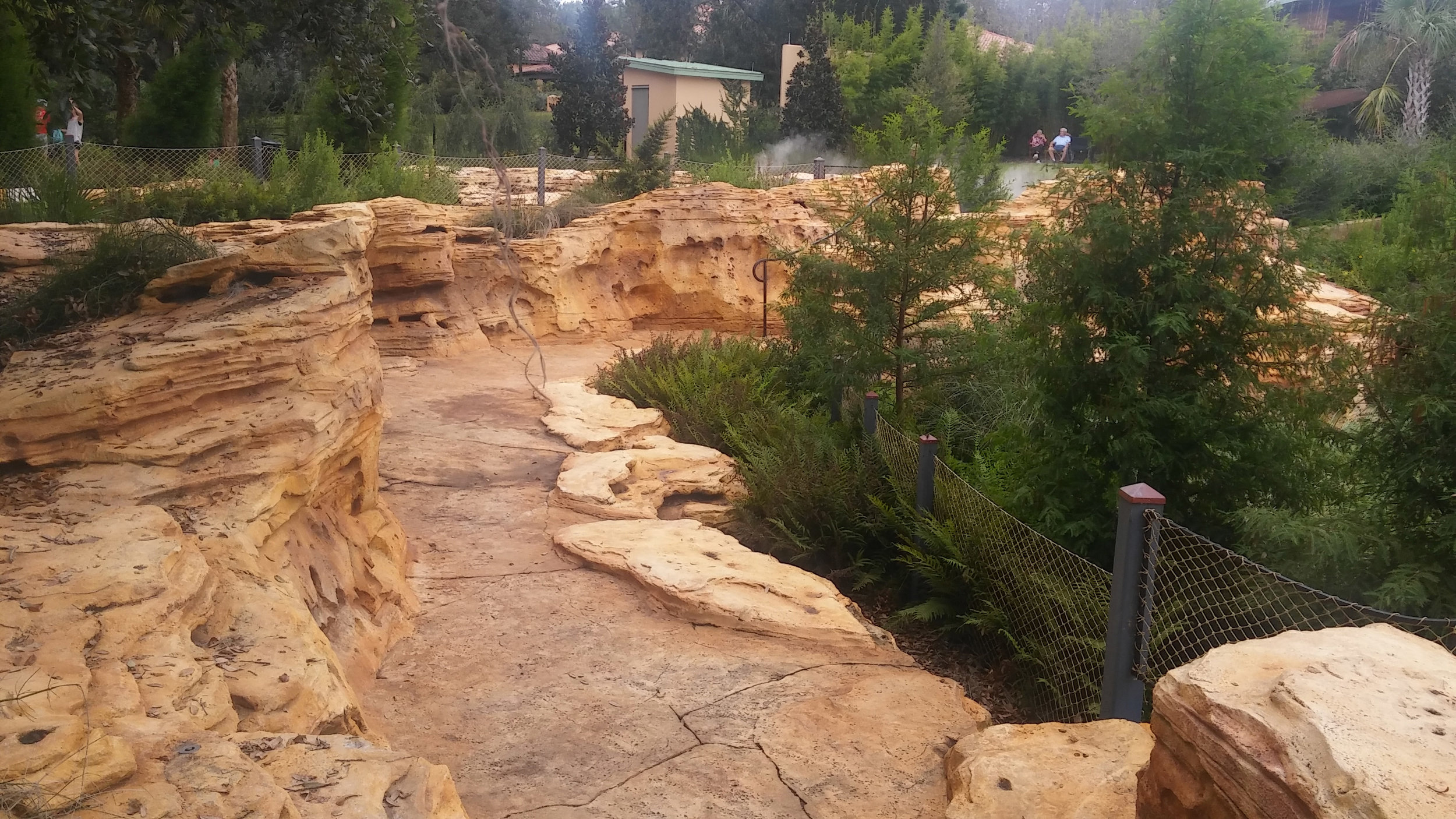 A misting area is set up where you can see two people sitting. Perfect to cool off on a hot day.