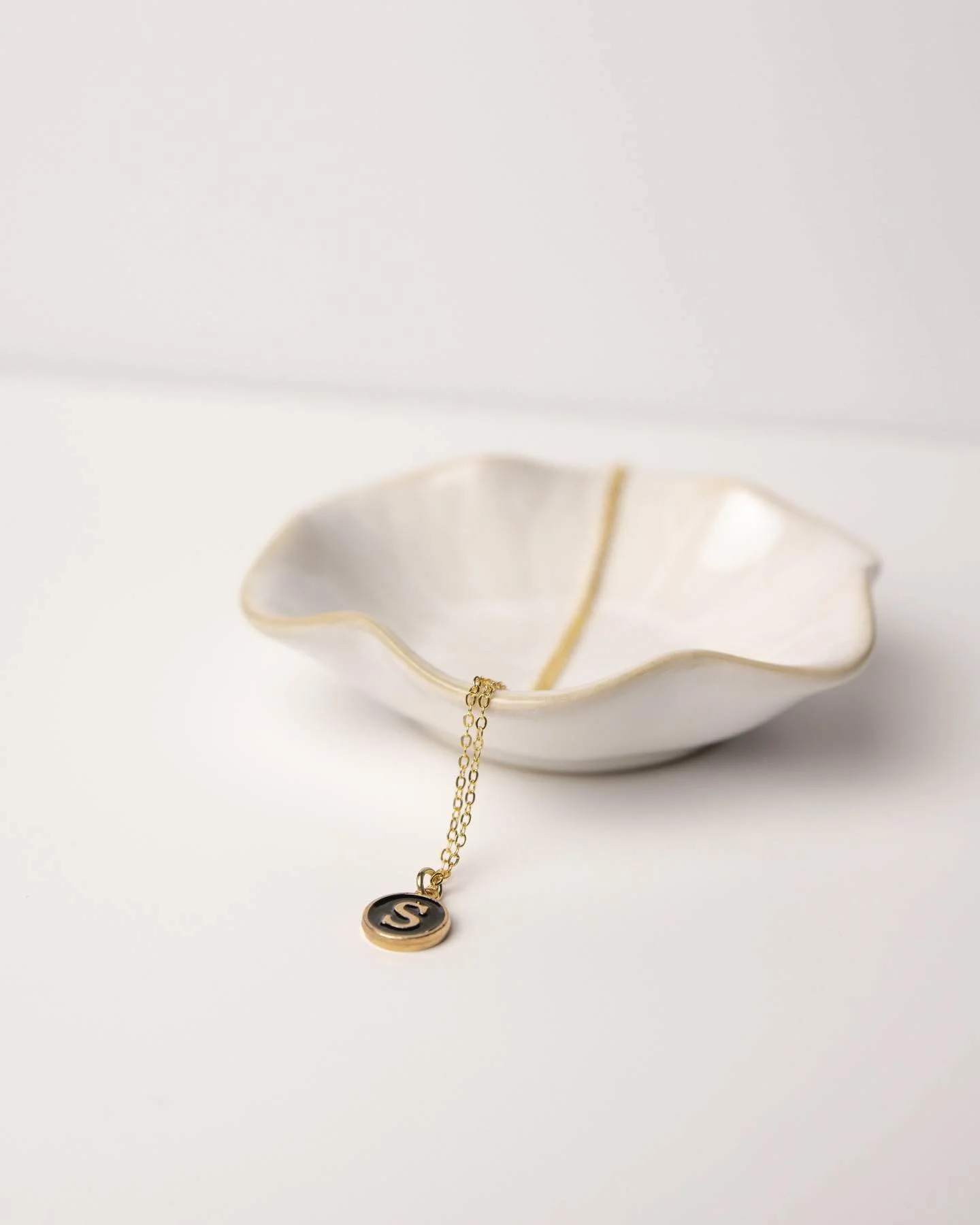 ✨A letter that means something 🤍

✨Get Our most popular enamel initial charm for that special someone this holiday!!! 

✨The necklace rests on a 16k gold, 18&rdquo; chain &mdash; soft, simple, and full of meaning. Whether it&rsquo;s your initial, so