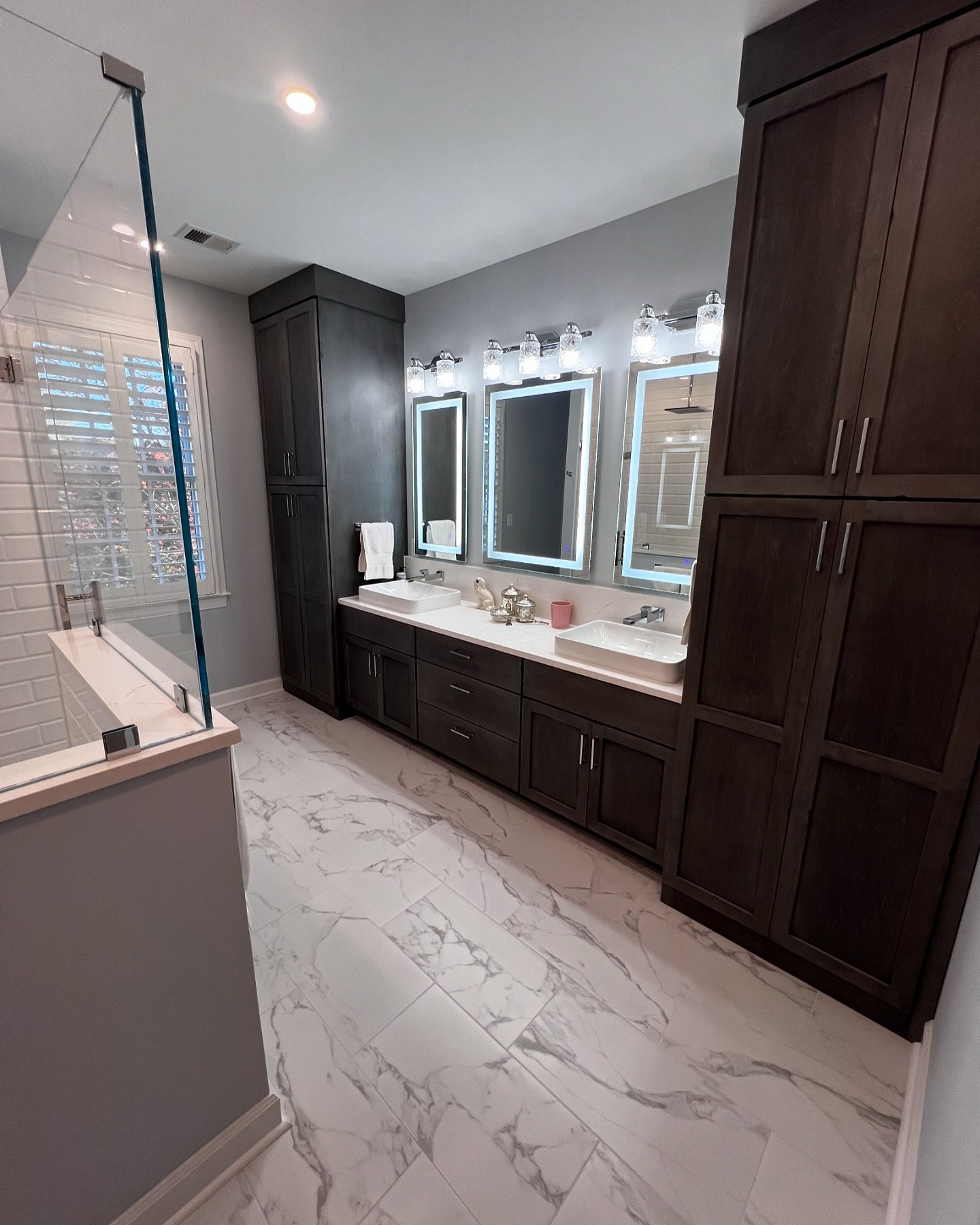 New bath project for a client who was just the nicest, most appreciative client to work with! This primary bath include lighted LED mirrors, heated floors, heated towel rack, semi-custom cabinetry, a rain shower and Brizo faucets from their Frank Llo