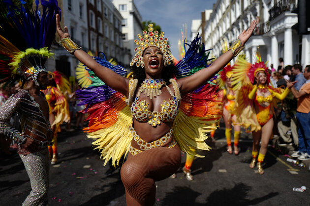 Carnival performers participate in the parade on the main day of the Notting Hill Carnival in west London on August 28, 2017.
Nearly one million people are expected by the organizers Sunday and Monday in the streets of west London's Notting Hill to celebrate Caribbean culture at a carnival considered the largest street demonstration in Europe. / AFP PHOTO / Tolga AKMEN (Photo credit should read TOLGA AKMEN/AFP/Getty Images)