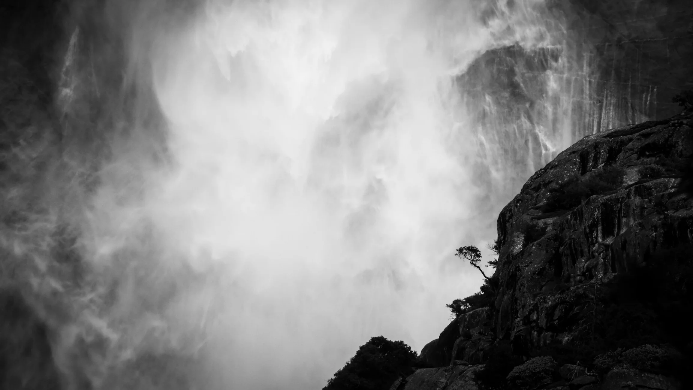 A tree ( wood ) thrives in balance on the side of a mountain ( earth, metal ) in the face of nature’s power as a wall of water , exposed to the wind and sun ( fire ); in the rush of surrounding life, within the elements, the tree’s roots rest in their foundation.