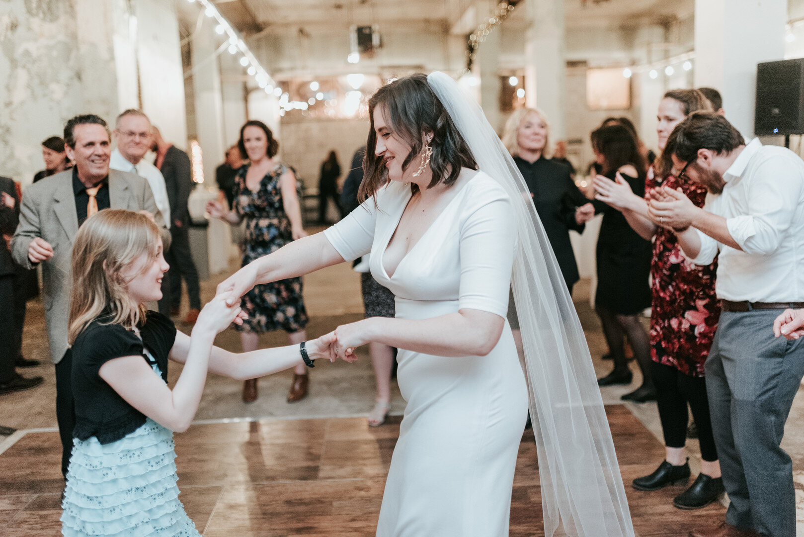 Rachel and Matthew transformed an empty non-profit building where she works into an industrial urban chic wedding in Philadelphia, Pennsylvania. Photographed by Elizabeth Gibbs Photography.