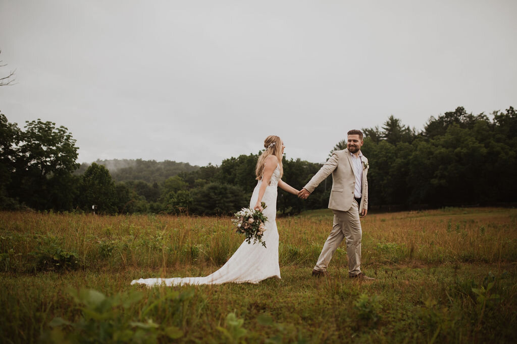 Even the rain couldn’t stop this couple from saying “I Do” at Green Lane park in Montgomery County. Pennsylvania. Photographed by Laura Briggs Photography.