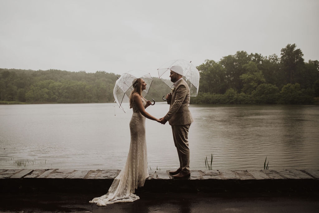 Even the rain couldn’t stop this couple from saying “I Do” at Green Lane park in Montgomery County. Pennsylvania. Photographed by Laura Briggs Photography.