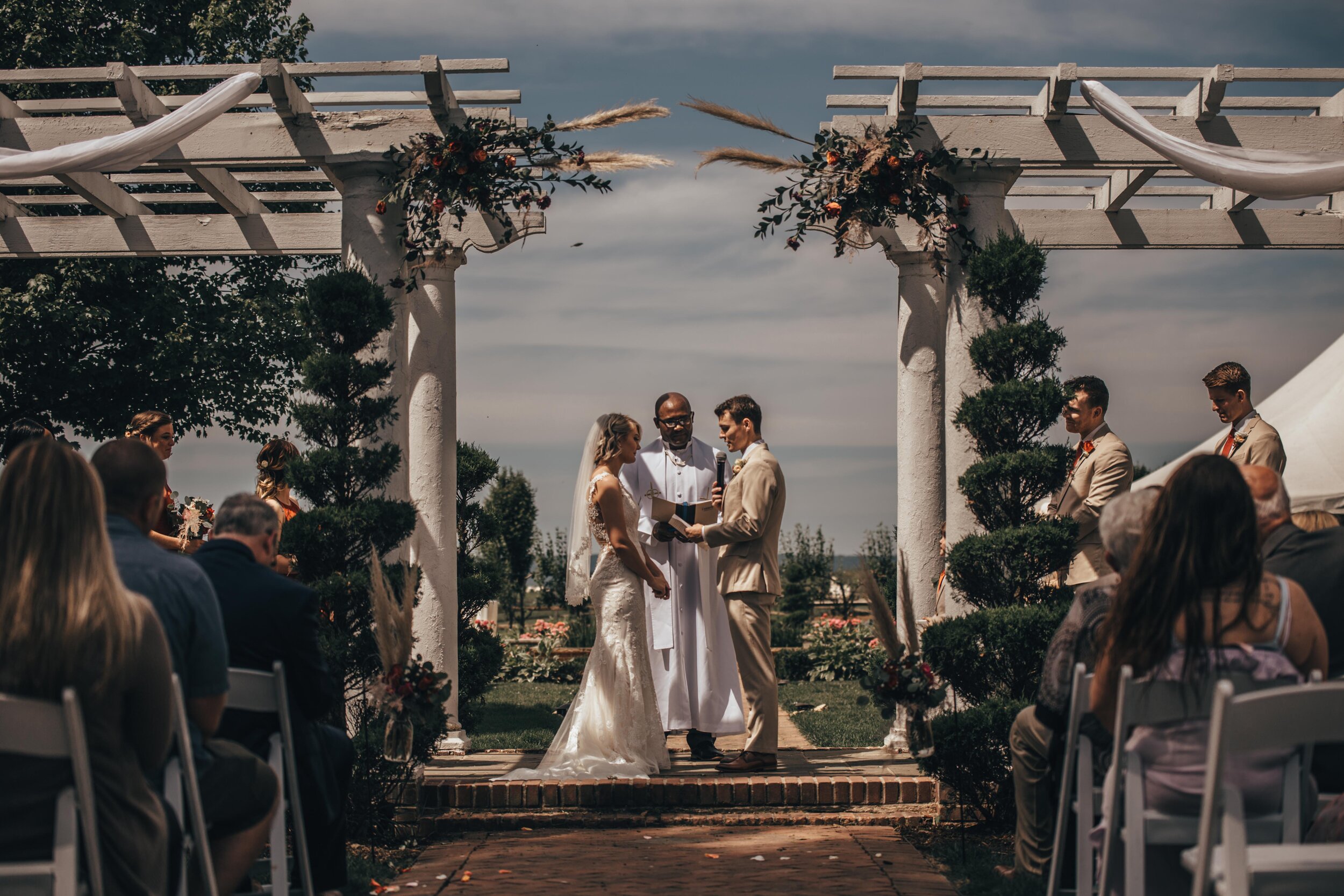 Faced with having to cancel their original plans, Alexia and CJ re-planned their wedding day in just three months. Opting for a romantic micro wedding in the bride’s parent’s backyard in New Ringgold, Pennsylvania. Photographed by Sarah Brookhart Ph…