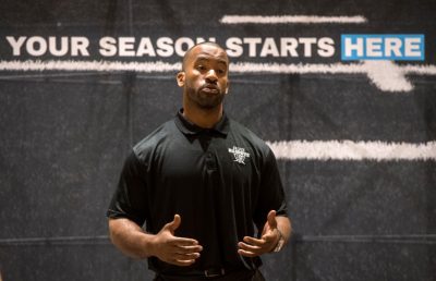 Former San Diego Charger turned youth football coach Stephen Cooper speaks at the press conference