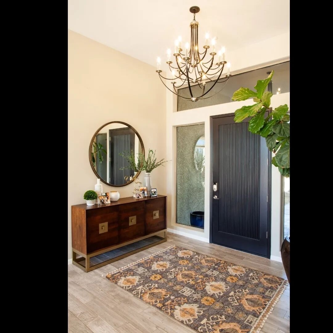 Before and After...
I love how this entrance space came alive with a little paint! A brighter and softer color was what this home needed. The flooring did not change, but just look at how different it seems than before. New furniture and accessories 