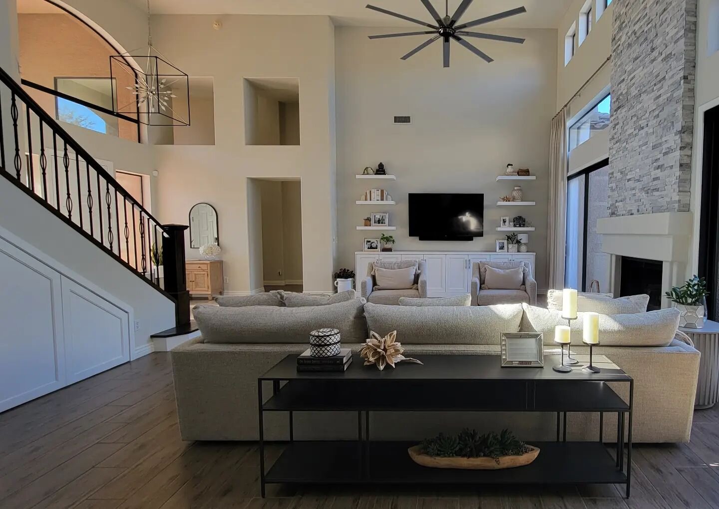 We have a few pieces to add before we're done, but this living room in this McCormick Ranch project is really coming together! The entertainment center is all new, as well as the paneling under the stairs that hides storage. I designed them to custom