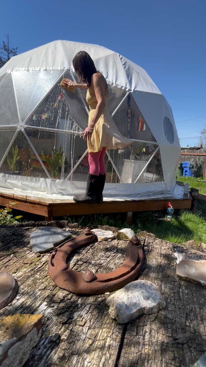 Spring cleaning for the ecotherapy office. Washing off the soot and algae, trimming back blackberry growth, applying UV protectant on the vinyl windows. #filteringlightcounseling #geodesicdome #spring