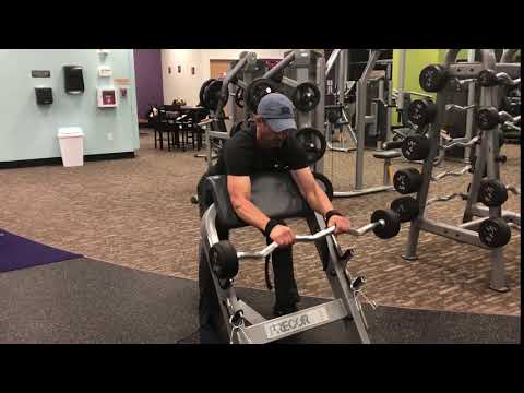 43.Reverse grip bicep barbell curl on preacher machine