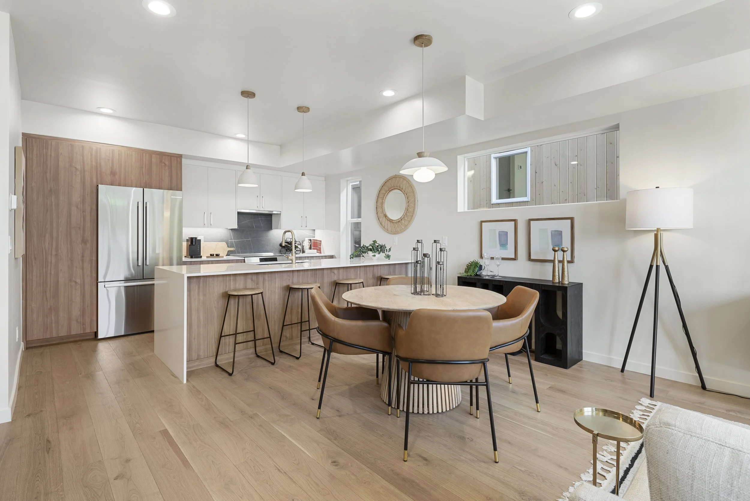 Stuart Residences kitchen and dining with walnut cabinetry and white quartz island