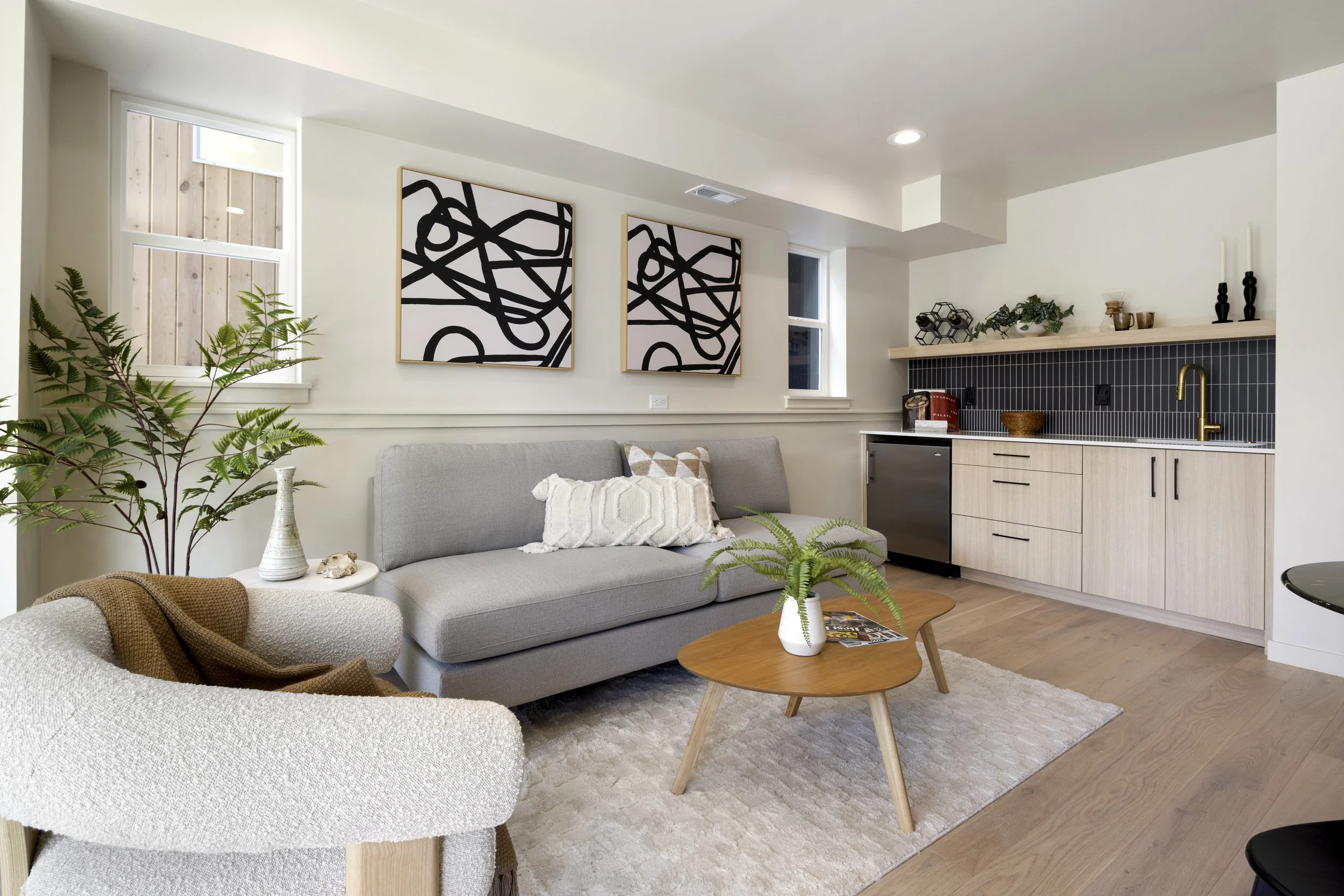 Stuart Residences living room and kitchen with navy tile backsplash