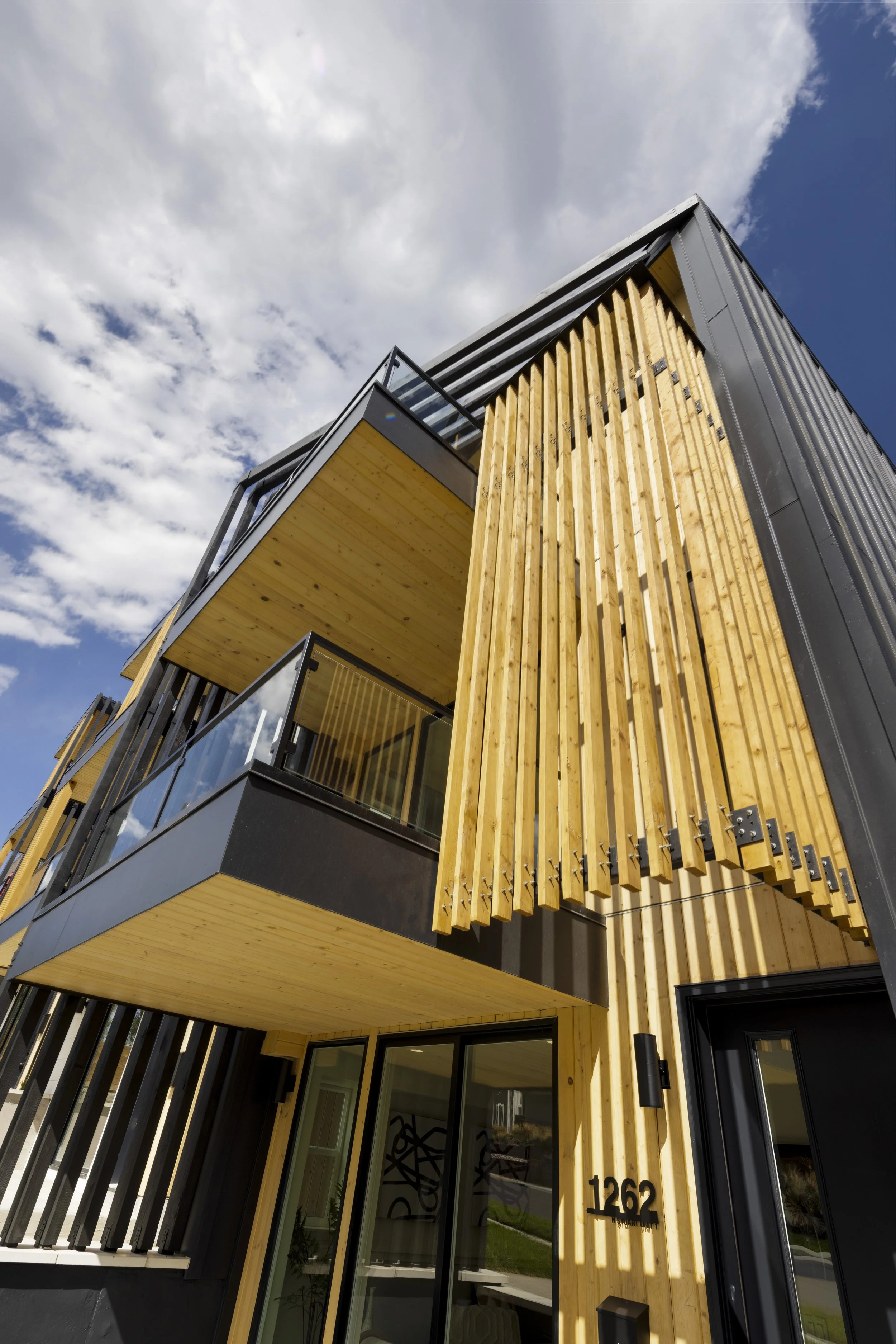Stuart Residences vertical wood slat cladding detail