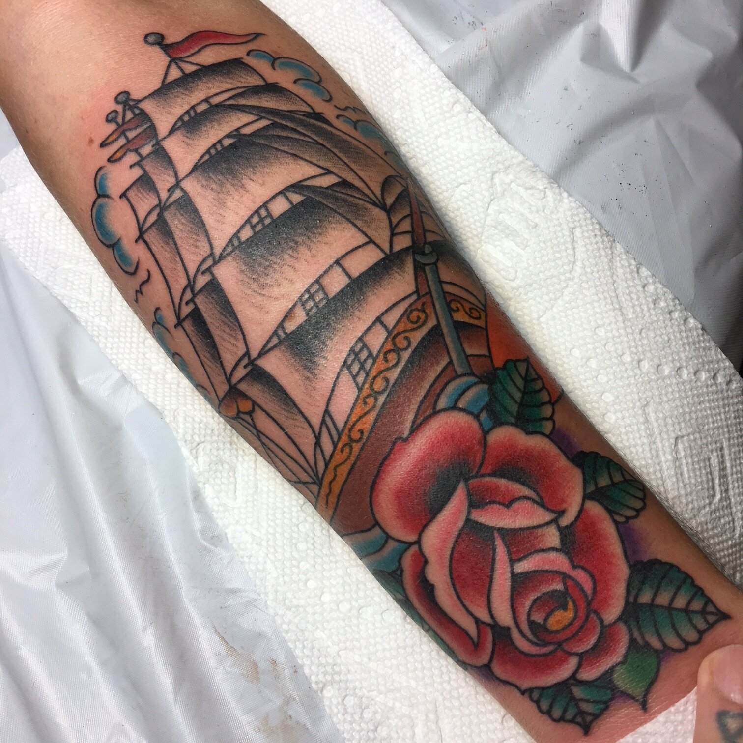Clipper Ship with rose tattoo in color by Brian Gattis at Southern Star Tattoo in Atlanta, Georgia