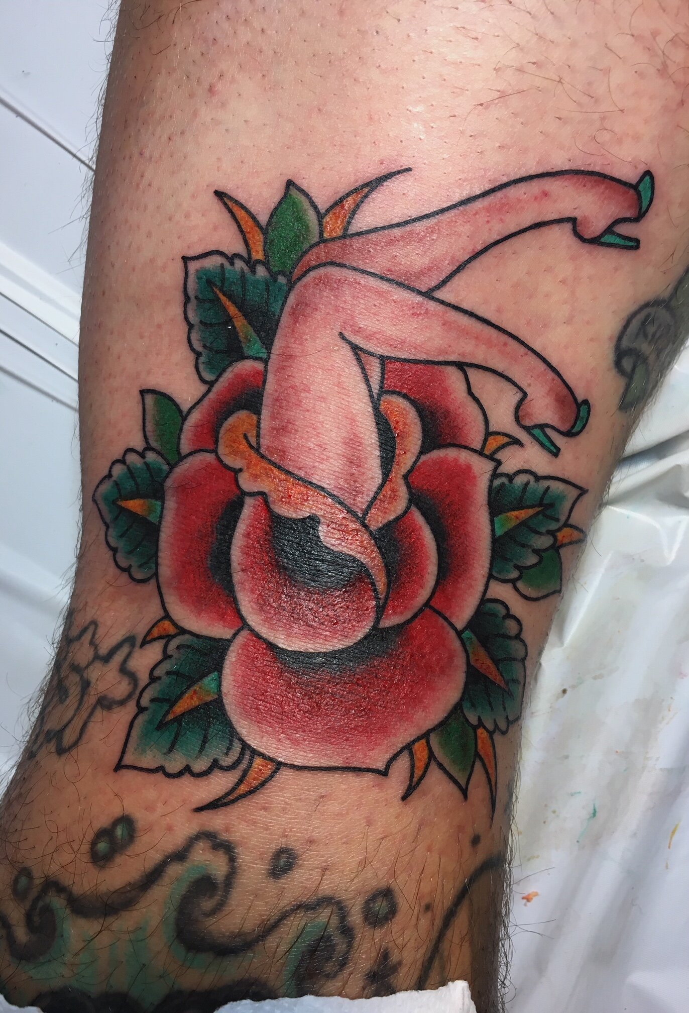 Traditional rose tattoo with pin up girl in color by Brian Gattis at Southern Star Tattoo in Atlanta, Georgia