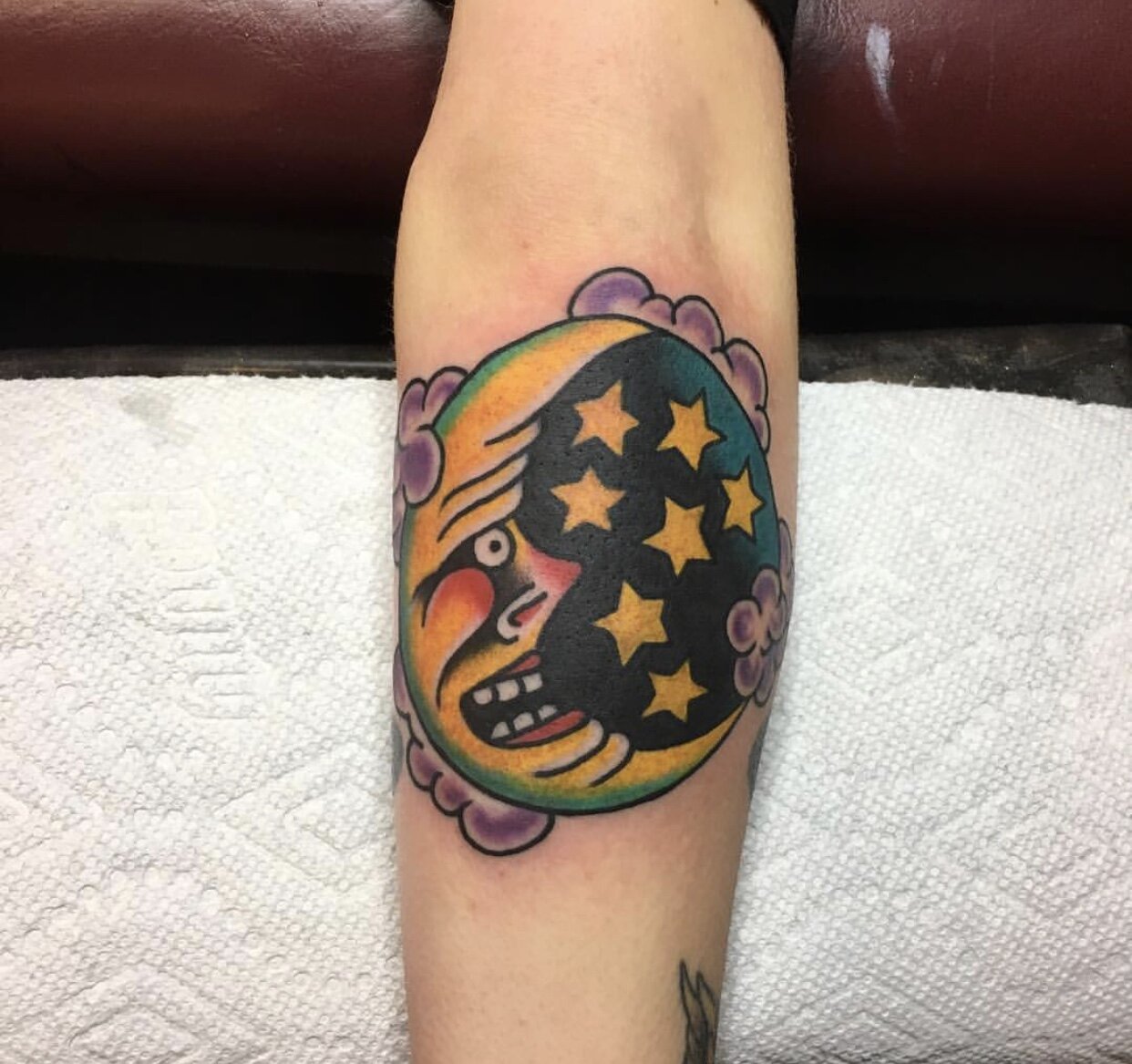 Crescent moon tattoo in bold color by Andrew Patch at Southern Star Tattoo in Atlanta, Georgia.