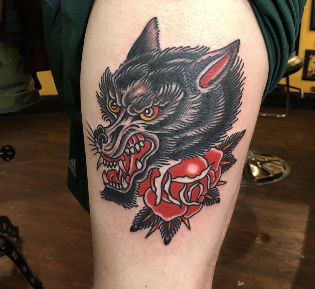 Wolf head with rose tattoo by Andrew Patch at Southern Star Tattoo in Atlanta, Georgia.