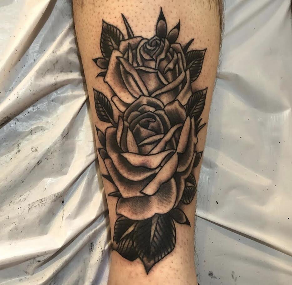 Traditional roses tattooed in black and grey by Andrew Patch at Southern Star Tattoo in Atlanta, Georgia.