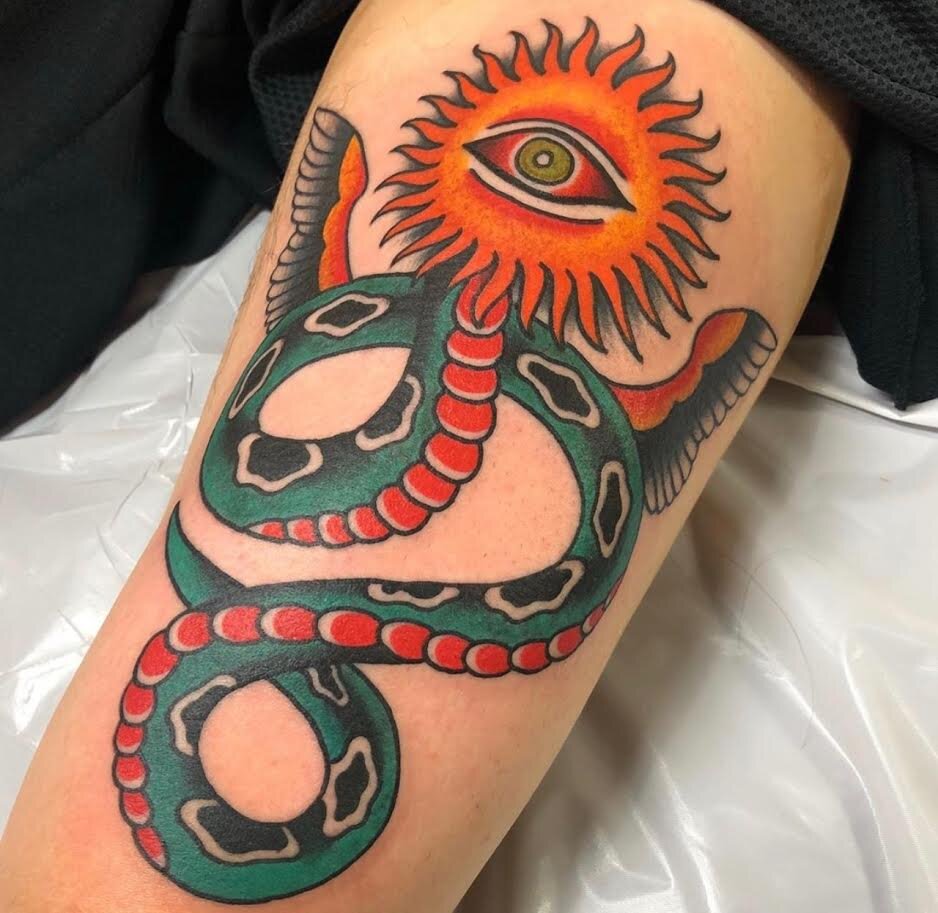 Traditional color snake tattoo with eye for head by Andrew Patch at Southern Star Tattoo in Atlanta, Georgia.